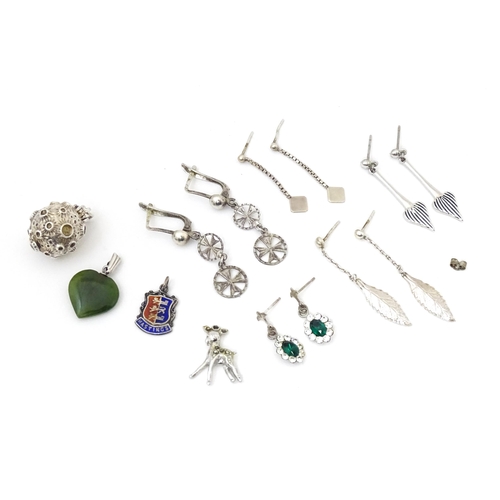 717 - Assorted silver plate, silver and white metal charms etc to include   a charm formed as a planet ope... 