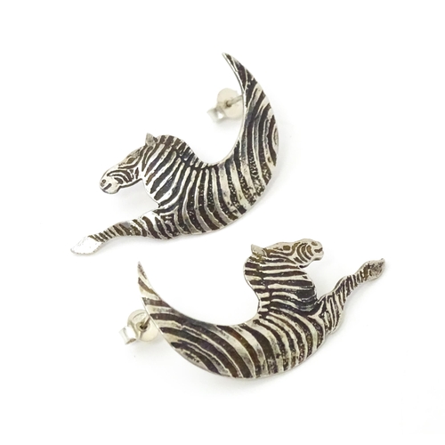 718 - A pair of silver earrings formed as stylized zebras. Hallmarked London 1989 maker MED. approx 1 3/4