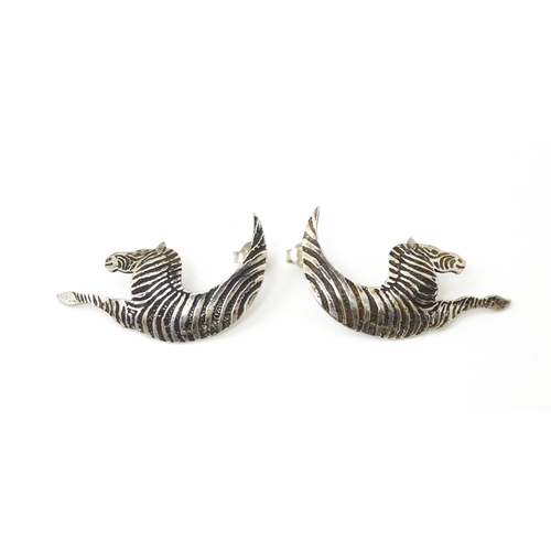 718 - A pair of silver earrings formed as stylized zebras. Hallmarked London 1989 maker MED. approx 1 3/4