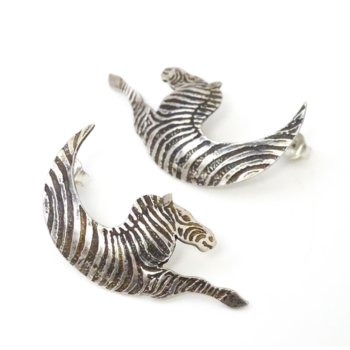 718 - A pair of silver earrings formed as stylized zebras. Hallmarked London 1989 maker MED. approx 1 3/4