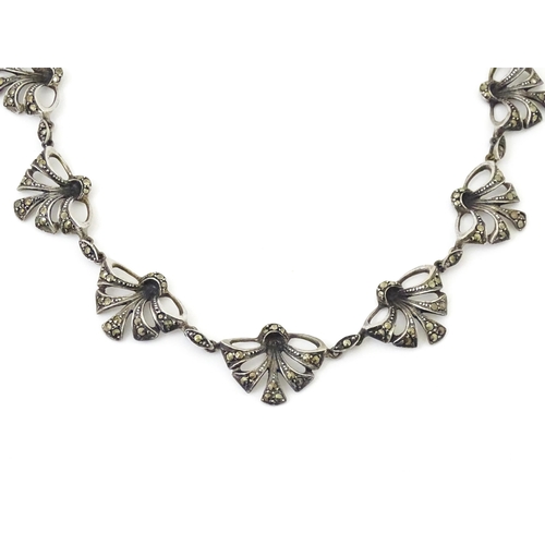 719 - A silver necklace with marcasite detail Approx 16