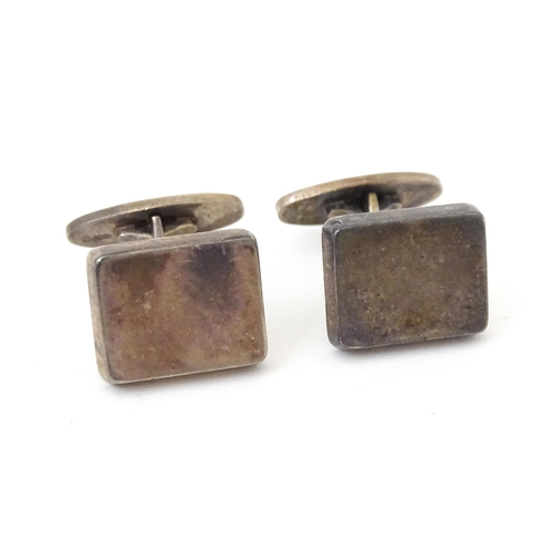 720 - A pair of Danish silver cufflinks designed  by Flemming Eskildsen for Georg Jensen and numbered '84'... 