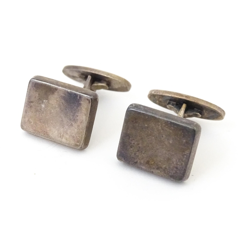 720 - A pair of Danish silver cufflinks designed  by Flemming Eskildsen for Georg Jensen and numbered '84'... 