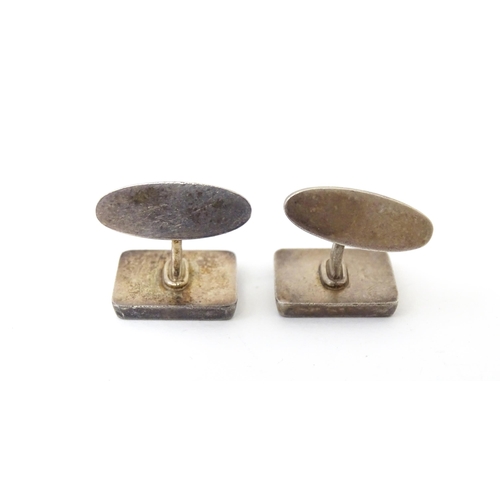 720 - A pair of Danish silver cufflinks designed  by Flemming Eskildsen for Georg Jensen and numbered '84'... 