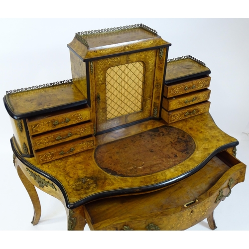 1590 - A 19thC burr walnut Bonheur du jour, with a brass gallery surmounting the two banks of three short d... 