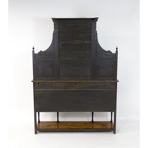 1628 - A late 19thC / early 20thC rosewood sideboard with a mirrored back, pierced galleries, turned suppor... 