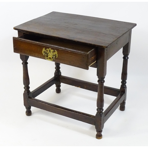 1701 - An 18thC oak side table with a later top and single short drawer above four turned legs united by a ... 