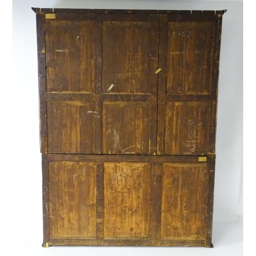 1726 - A large Georgian mahogany bookcase with a moulded cornice above three astragal glazed doors and the ... 