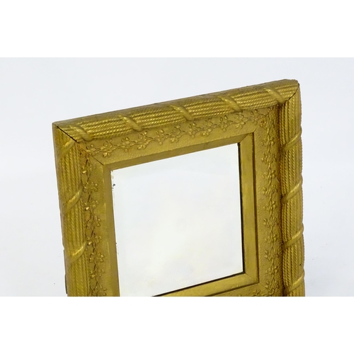 1698 - An early / mid 20thC mirror with a gilt painted moulded frame. 17