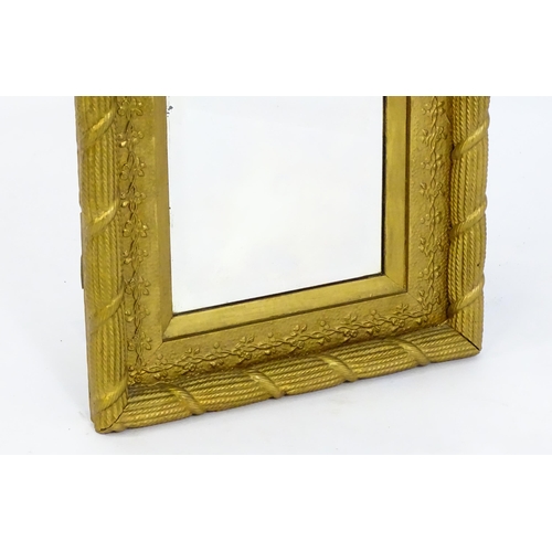 1698 - An early / mid 20thC mirror with a gilt painted moulded frame. 17