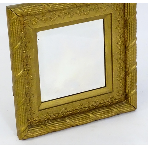 1698 - An early / mid 20thC mirror with a gilt painted moulded frame. 17