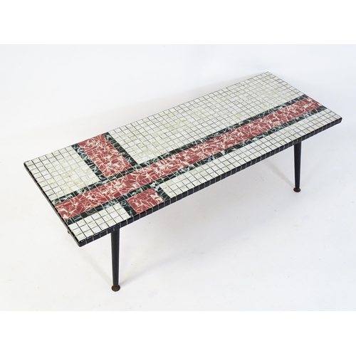 1785 - Vintage / Retro: A coffee table with a ceramic tiled coffee table raised on four turned tapering leg... 