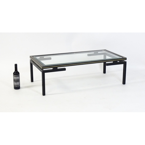 1789 - A late 20thC Pierre Vandel designed glass top coffee table. 42