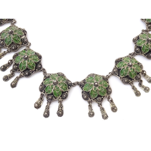 734 - A silver necklace in the Austro-Hungarian style with enamel decoration. Together with Continental wh... 