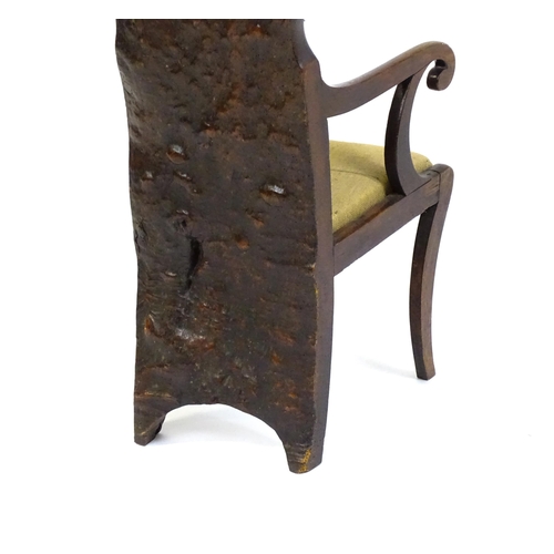 1606 - A Regency period rare 'Dug-out' chair, with a single large piece of wood forming the backrest and ba... 