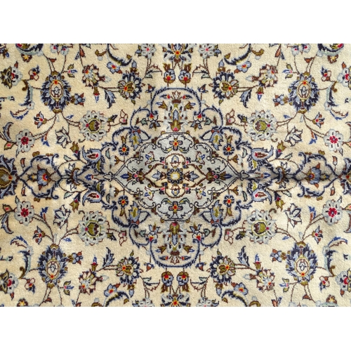 1494 - Carpet / Rug : A Central Persian Kashan carpet, the cream ground with central medallion with floral ... 