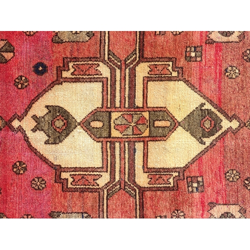 1495 - Carpet / Rug :  A North West Persian Heriz runner, the cream,  red and black grounds with geometric ... 