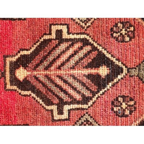 1495 - Carpet / Rug :  A North West Persian Heriz runner, the cream,  red and black grounds with geometric ... 