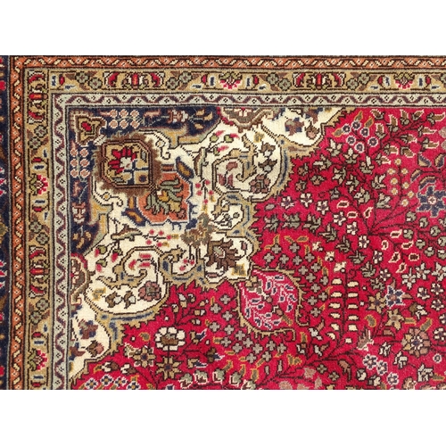 1496 - Carpet / Rug : A North West Persian Tabriz carpet, the red ground with central medallion of floral a... 