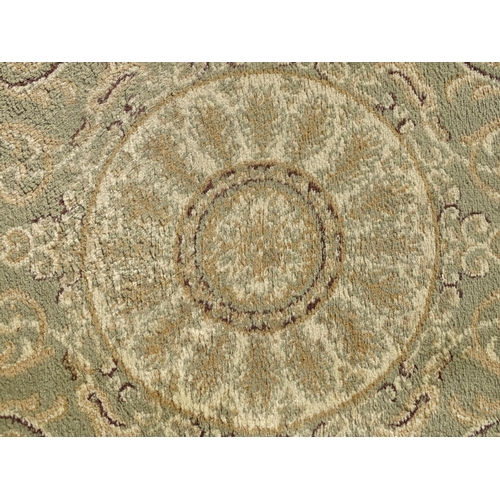 1497 - Carpet / Rug : A square rug with beige and sage green grounds decorated with central medallion  bord... 