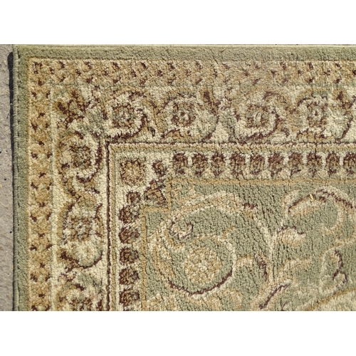 1497 - Carpet / Rug : A square rug with beige and sage green grounds decorated with central medallion  bord... 