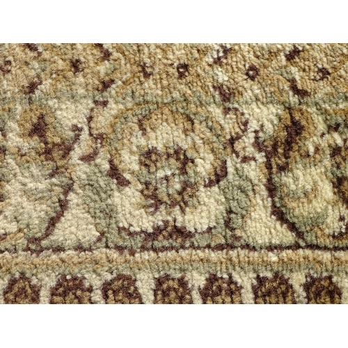 1497 - Carpet / Rug : A square rug with beige and sage green grounds decorated with central medallion  bord... 