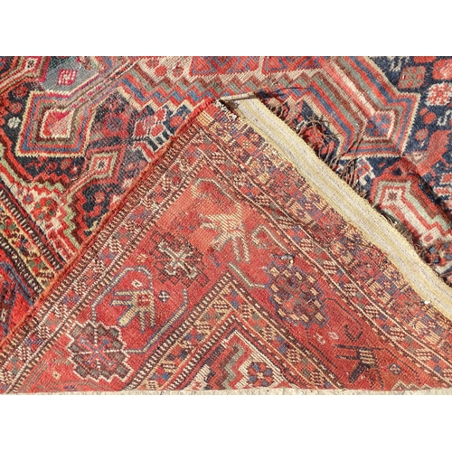 1504 - Carpet / Rug : A rug with red, cream, and dark blue ground decorated with central medallions having ... 