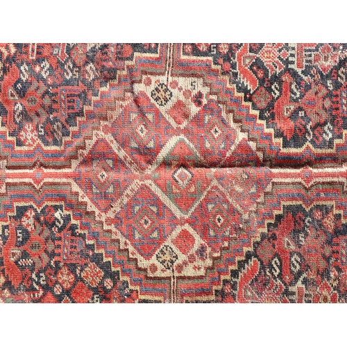 1504 - Carpet / Rug : A rug with red, cream, and dark blue ground decorated with central medallions having ... 