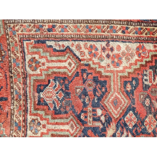 1504 - Carpet / Rug : A rug with red, cream, and dark blue ground decorated with central medallions having ... 