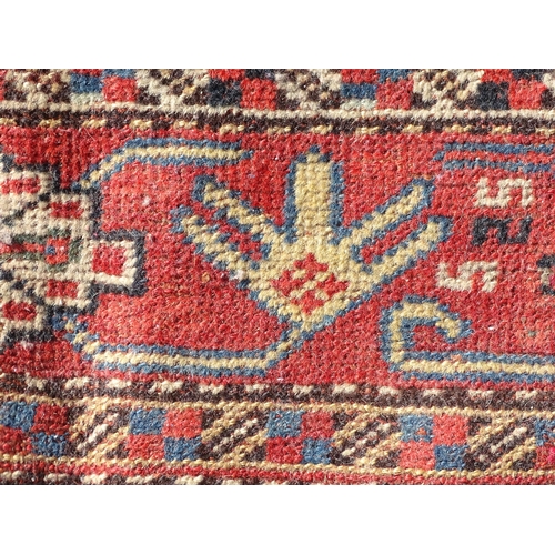 1504 - Carpet / Rug : A rug with red, cream, and dark blue ground decorated with central medallions having ... 