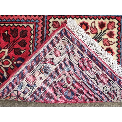 1521 - Carpet / Rug : A North West Persian Rudbar runner with red and cream ground having floral detail.  A... 