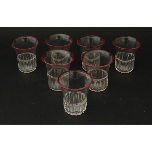 294 - Salviati & Co. Glassware: Seven Venetian glass tot / shot glasses with pink detail to rims. Approx. ... 