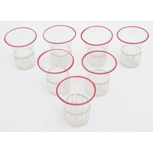 294 - Salviati & Co. Glassware: Seven Venetian glass tot / shot glasses with pink detail to rims. Approx. ... 