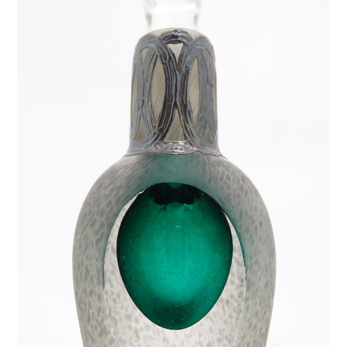 299 - A scent / perfume bottle with green detail and silver overall decoration to neck by Sileda Ltd. Appr... 