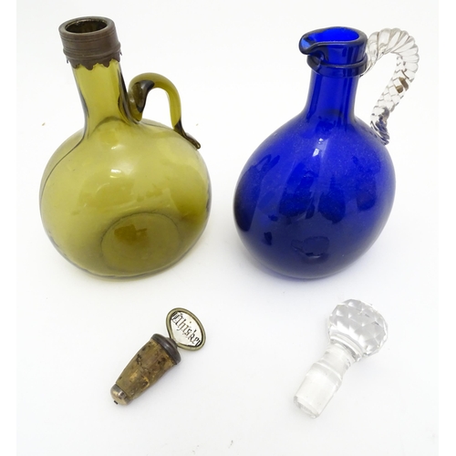 306 - Six assorted 19thC and later glass flagons / flasks with loop handles to include a Victorian Bristol... 