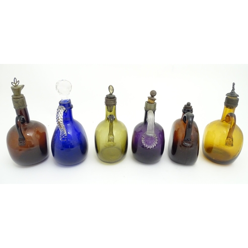 306 - Six assorted 19thC and later glass flagons / flasks with loop handles to include a Victorian Bristol... 