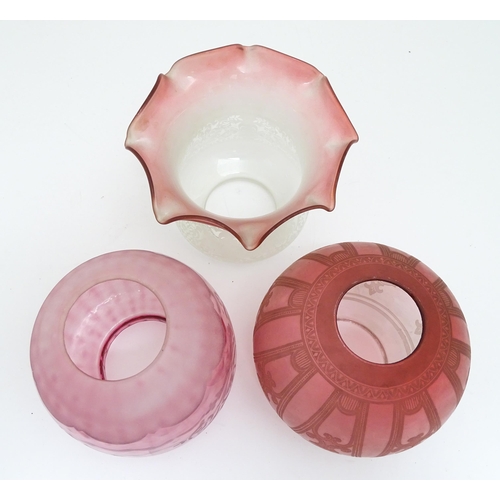 307 - Three various Victorian and later cranberry and pink glass lamp / light shades. The largest approx 6... 