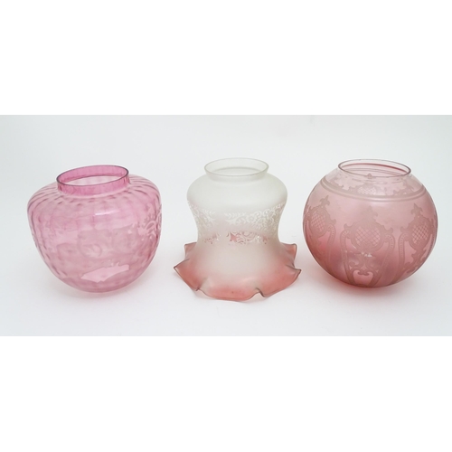 307 - Three various Victorian and later cranberry and pink glass lamp / light shades. The largest approx 6... 