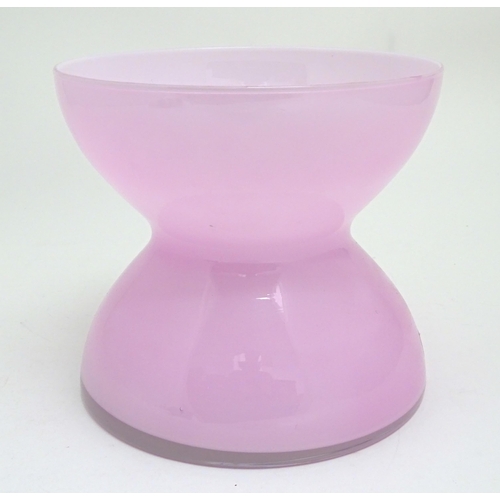 310 - A pink hour glass vase designed by Anne Nilsson. Approx. 9