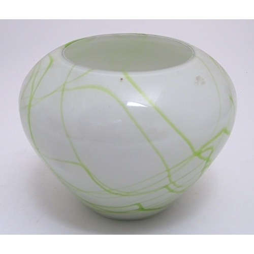 311 - A glass vase with green marbled detail. Approx. 7 1/2