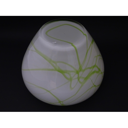 311 - A glass vase with green marbled detail. Approx. 7 1/2