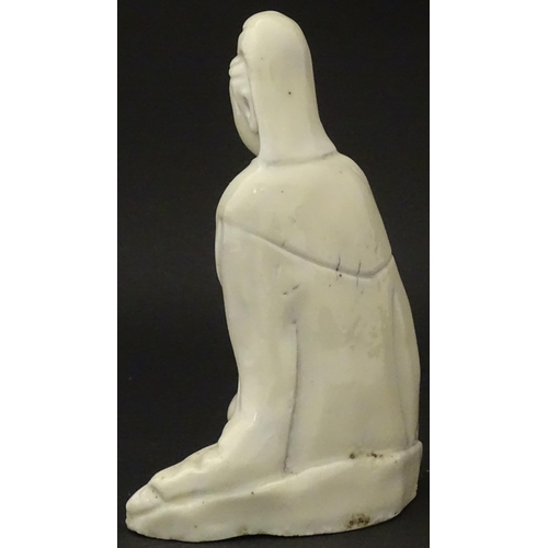 10 - A Chinese blanc de chine figure modelled as Guanyin seated. Approx. 4 3/4