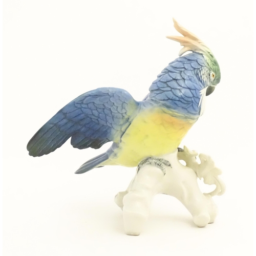 168 - A Karl Ens model of a Parrot / Cockatoo perched on a branch. Marked under. Approx. 9