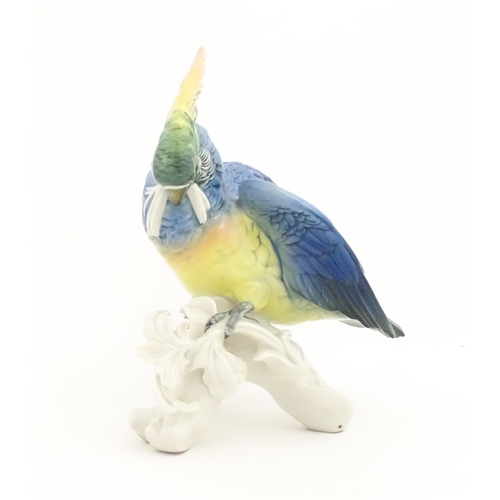 168 - A Karl Ens model of a Parrot / Cockatoo perched on a branch. Marked under. Approx. 9