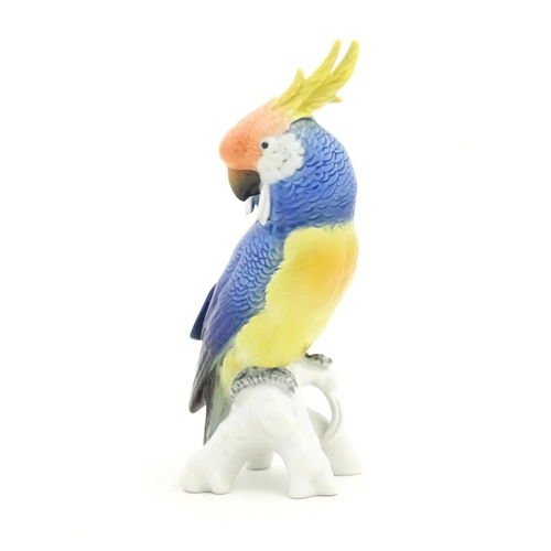 169 - A Karl Ens model of a Parrot / Cockatoo perched on a branch. Marked under. Approx. 7 3/4