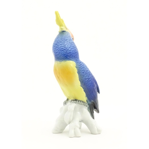 169 - A Karl Ens model of a Parrot / Cockatoo perched on a branch. Marked under. Approx. 7 3/4