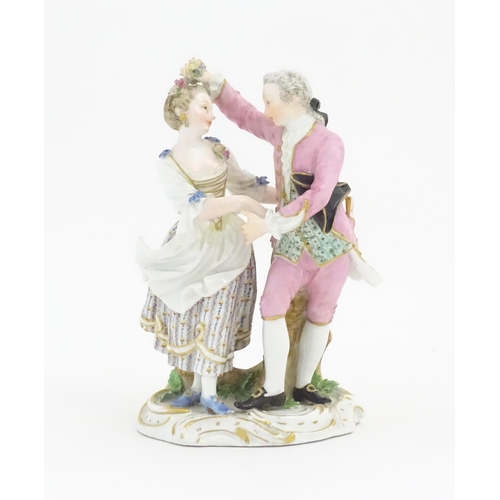 176 - A Meissen figure group modelled as a dancing couple. Marked under. Approx. 6