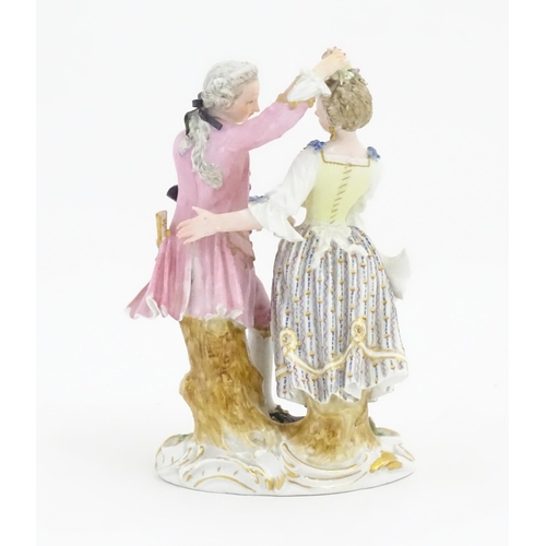 176 - A Meissen figure group modelled as a dancing couple. Marked under. Approx. 6