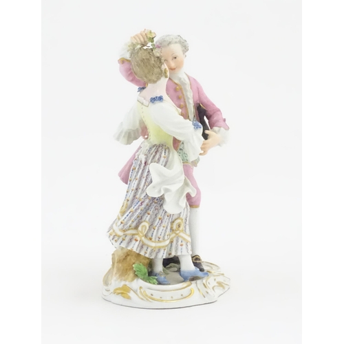 176 - A Meissen figure group modelled as a dancing couple. Marked under. Approx. 6