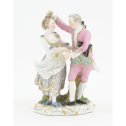 176 - A Meissen figure group modelled as a dancing couple. Marked under. Approx. 6